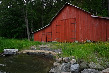 Image showing traditional old red finnish boat shed by the lake