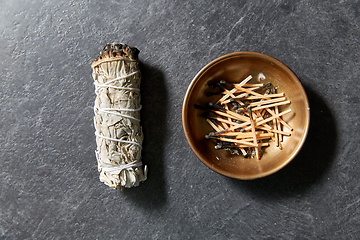 Image showing white sage and cup with burnt matches