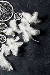 Image showing dreamcatcher on dark slate stone background