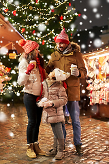 Image showing family with takeaway drinks at christmas market