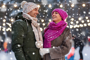 Image showing happy couple at outdoor skating rink in winter