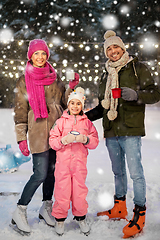 Image showing happy family drinking hot tea on skating rink