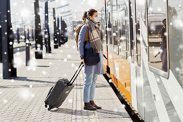 Image showing woman in protective face mask at railway station