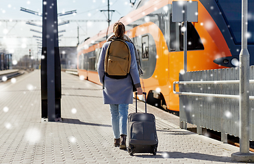 Image showing woman with travel bag on railway station