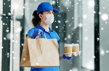 Image showing delivery woman in face mask with food and drinks