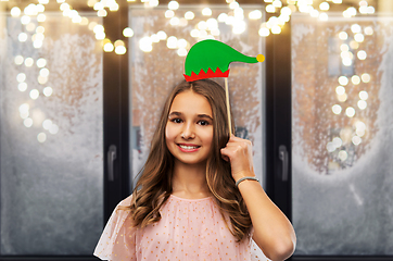 Image showing happy teenage girl with santa helper hat accessory