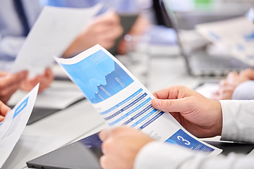 Image showing close up of business team with papers at office