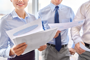 Image showing happy business team with papers meeting at office