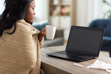 Image showing sick woman with tea having video call on laptop