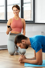 Image showing happy couple exercising at home