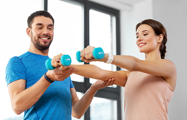 Image showing happy couple exercising at home