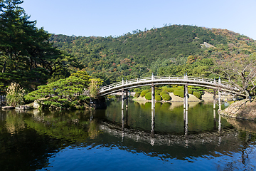 Image showing Traditional Ritsurin Garden and wooden bridge