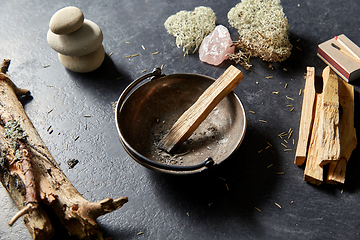 Image showing palo santo stick in cup and staff for magic ritual