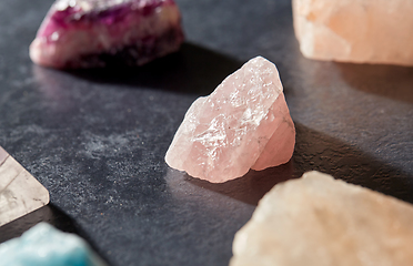 Image showing quartz crystals and gem stones on slate background