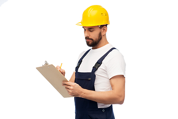 Image showing male worker or builder in helmet with clipboard