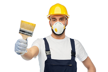 Image showing worker or builder in respirator with brush