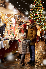 Image showing happy family at christmas market in city