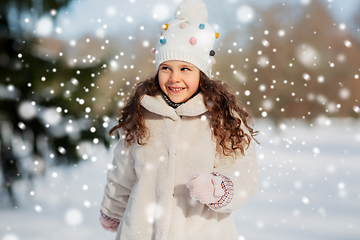 Image showing happy little girl in winter clothes outdoors