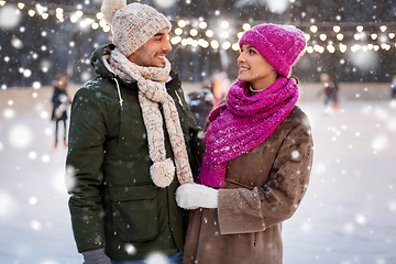 Image showing happy couple at outdoor skating rink in winter