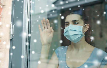 Image showing sick young woman wearing protective medical mask