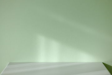 Image showing grey table and green wall