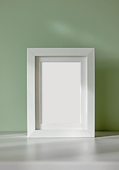 Image showing white frame on green background