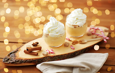 Image showing glasses of eggnog with whipped cream and anise