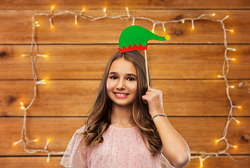 Image showing happy teenage girl with santa helper hat accessory