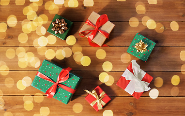 Image showing christmas gifts on wooden boards