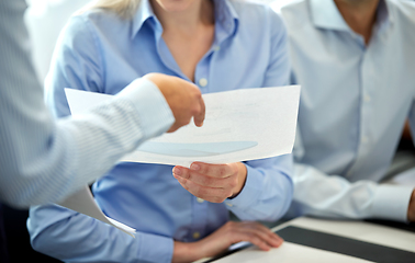 Image showing happy business team with papers meeting at office