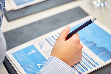 Image showing close up of businessman with papers at office