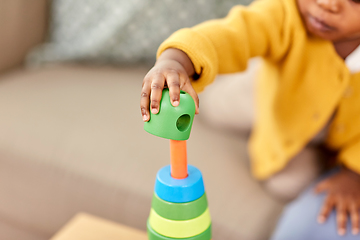 Image showing close up of african baby playing toy blocks