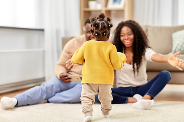 Image showing african family playing with baby daughter at home