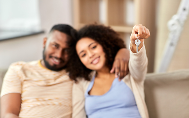 Image showing happy couple with house key moving to new home