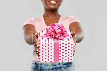 Image showing close up of african american woman with gift box