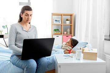 Image showing ill daughter and mother with laptop at home