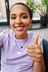 Image showing happy african american woman taking selfie at home