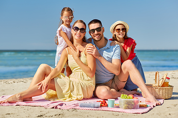 Image showing happy family having picnic on summer beach