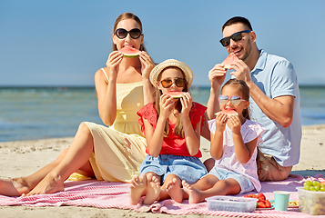 Image showing happy family having picnic on summer beach