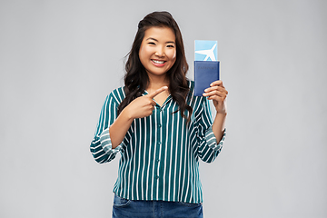 Image showing happy asian woman with air ticket and passport