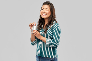 Image showing happy smiling asian woman with can drink