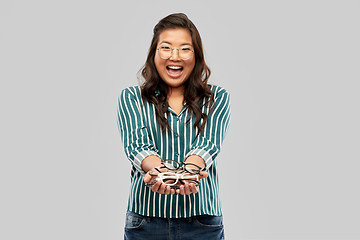 Image showing happy smiling asian woman in glasses or student