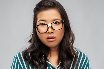 Image showing portrait of confused asian woman in glasses