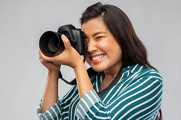 Image showing asian female photographer with digital camera