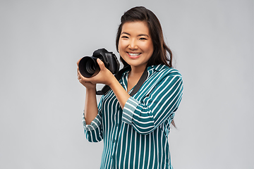 Image showing asian female photographer with digital camera