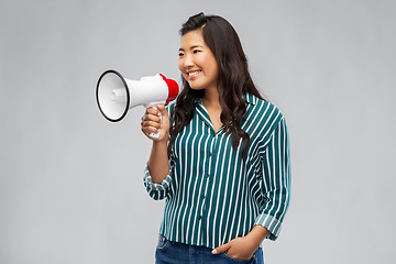 Image showing happy smiling asian woman speaking to megaphone