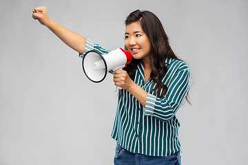 Image showing happy smiling asian woman speaking to megaphone