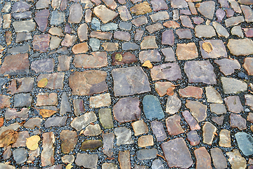 Image showing Old pavement of stones of different colors and sizes 