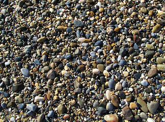 Image showing Wet sea pebbles on the beach
