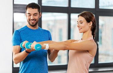 Image showing happy couple exercising at home